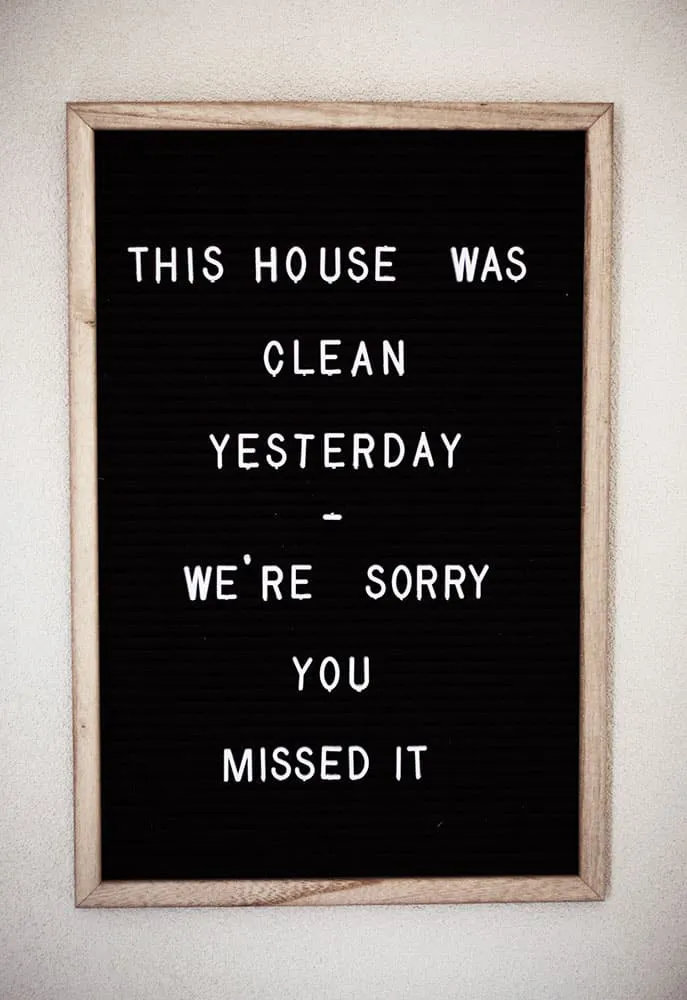 felt board with a quote about missing a clean house