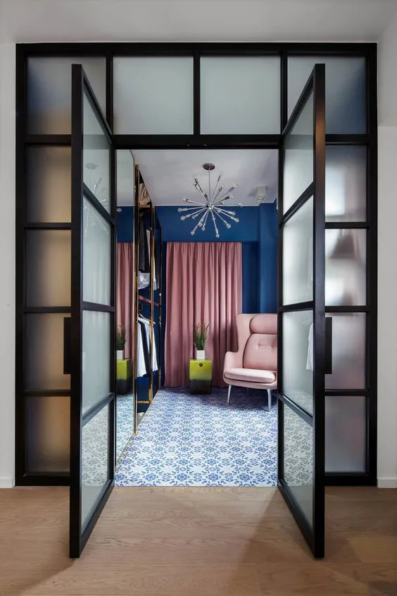 Walk in closet designed in shades of pink and blue