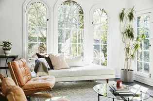 Clean living room with bright windows