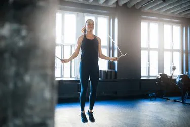A jumping rope during a HIIT workout, as an example of what to do to lose belly fat in two weeks